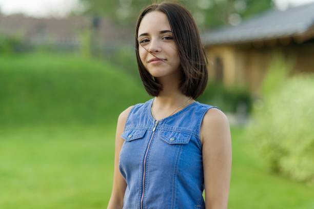 outdoor portrait of a pretty young girl 16 years old. - teenager 14 15 years 13 14 years cheerful imagens e fotografias de stock