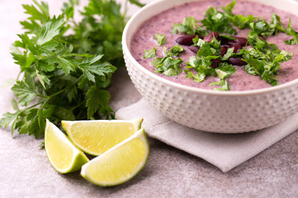 istock Mexican red bean puree soup with lime, parsley and chilli 1015292630