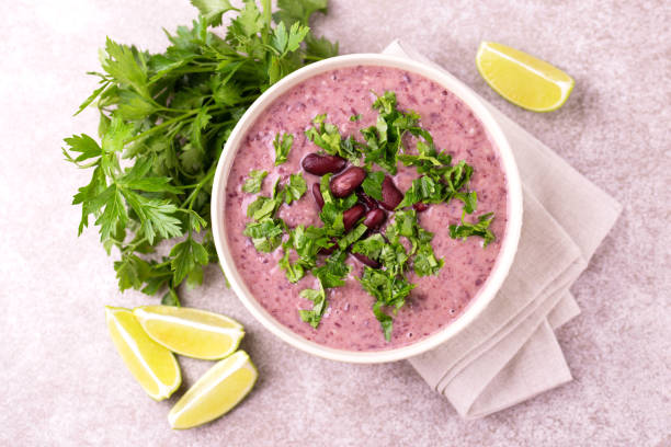 istock Mexican red bean puree soup with lime, parsley and chilli 1015294730