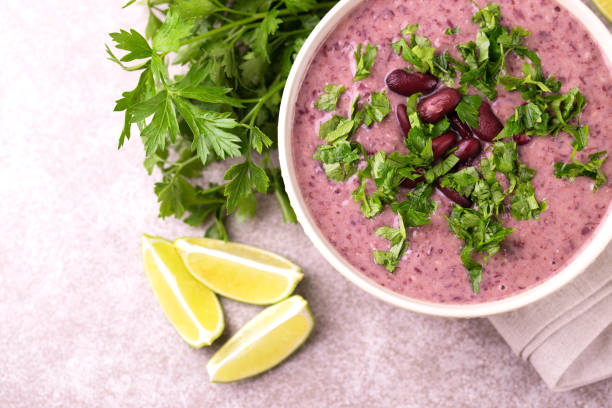 istock Mexican red bean puree soup with lime, parsley and chilli 1015294788
