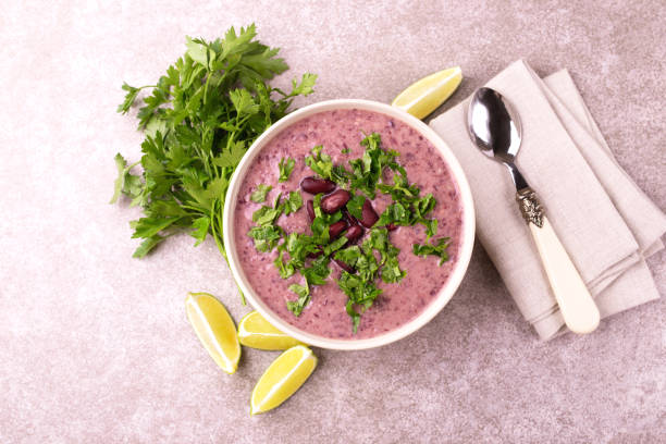 istock Mexican red bean puree soup with lime, parsley and chilli 1015294860