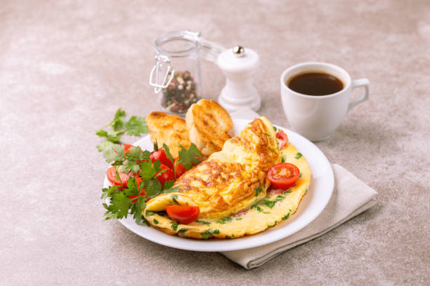 istock Herb omelette with tomatoes and panini toasts. Coffee. Breakfast 1015296146