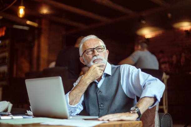 istock Mindful senior businessman in the cafeteria 1015300852