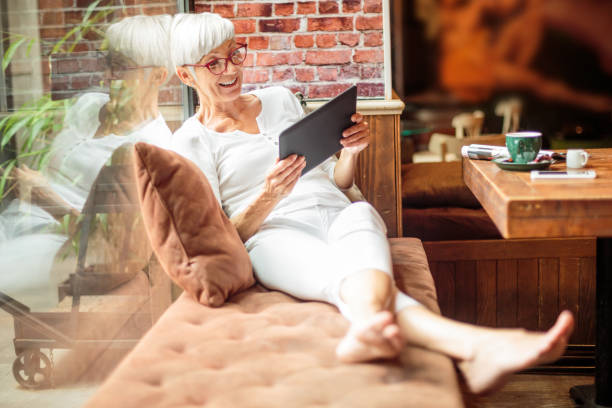 istock Senior woman with digital tablet 1015301032