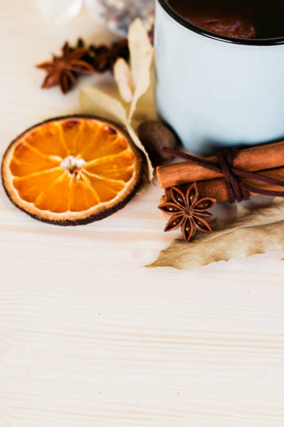 istock Autumn, fall leaves, hot steaming cup of glint wine 1015301236