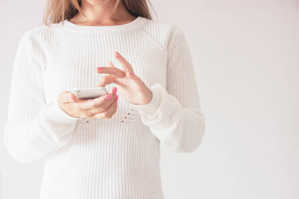 istock Front Close up of Woman Using Mobile Smart Phone, Touching Screen 1015301346