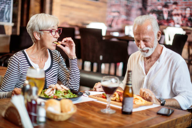 istock Senior couple eating in the restaurant 1015301388