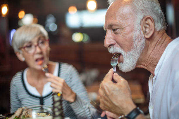 istock Senior couple eating in the restaurant 1015301794