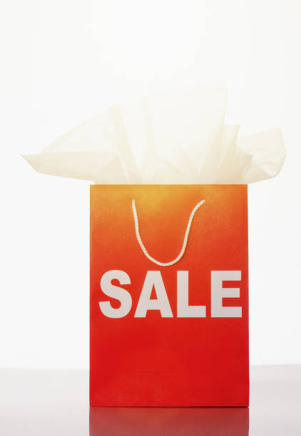 istock Bright red shopping bag marked SALE 1015301930