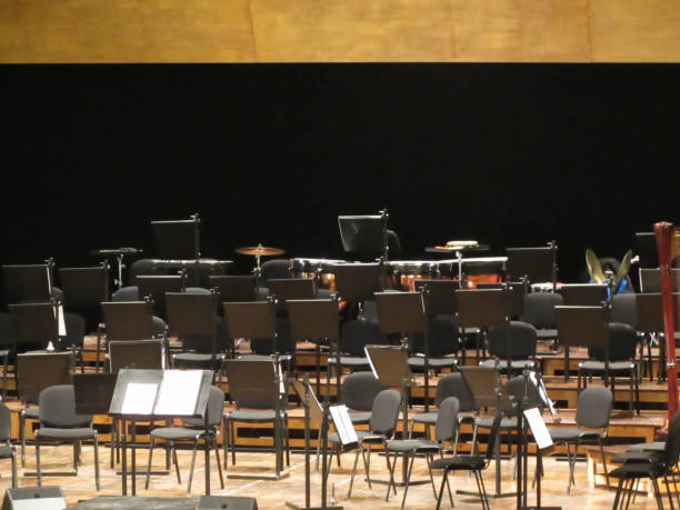 istock Empty chairs stand on stage in concert hall 1015305632