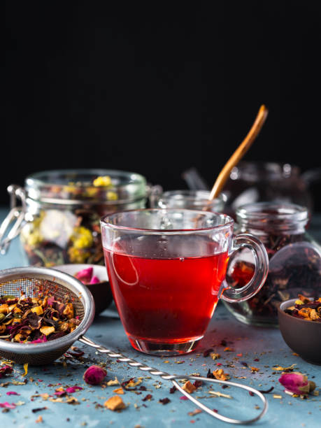 istock Process brewing tea ,tea ceremony, Cup of freshly brewed fruit and herbal tea, dark mood. 1015308878
