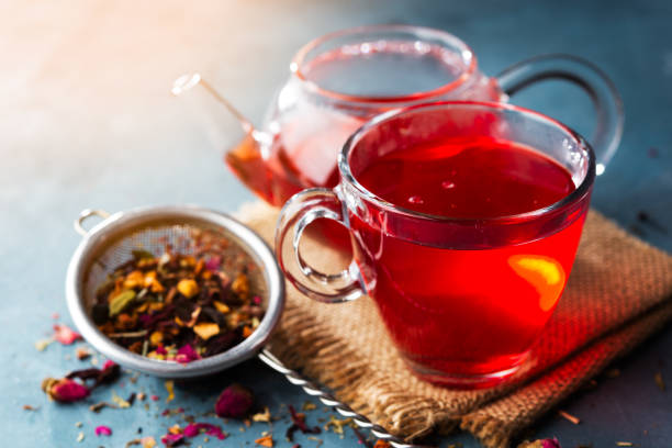 Process brewing tea ,tea ceremony ,Cup of freshly brewed fruit and herbal tea, dark mood.