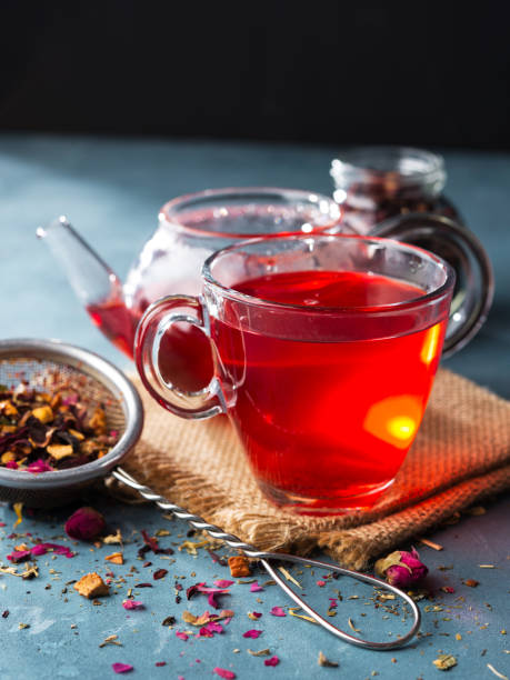 istock Process brewing tea, tea ceremony, Cup of freshly brewed fruit and herbal tea, dark mood. 1015309034