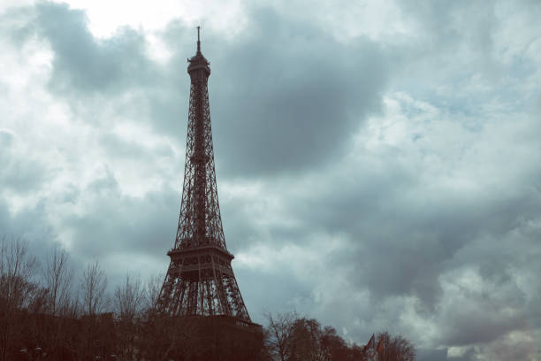 istock Eiffel tower against the cloudy sky, rain clouds, drama, autumn 1015309190