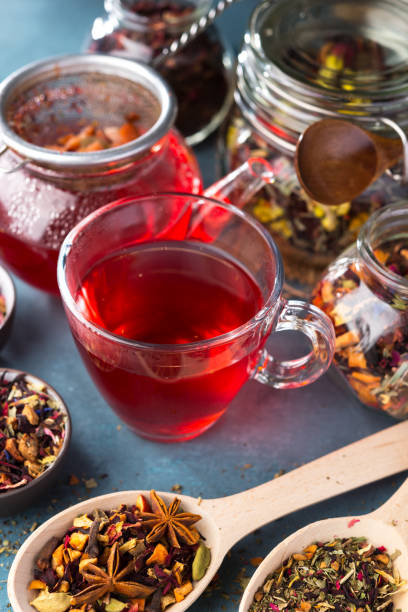 istock Fresh fruit and herbal tea ,dry leafs  with rose petals. Summer refreshing drink. Dark mood. 1015309718