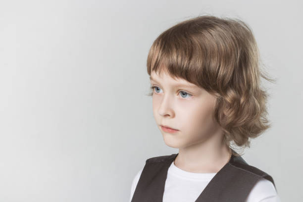 istock child emotionally posing on camera in the Studio on a white background 1015313954