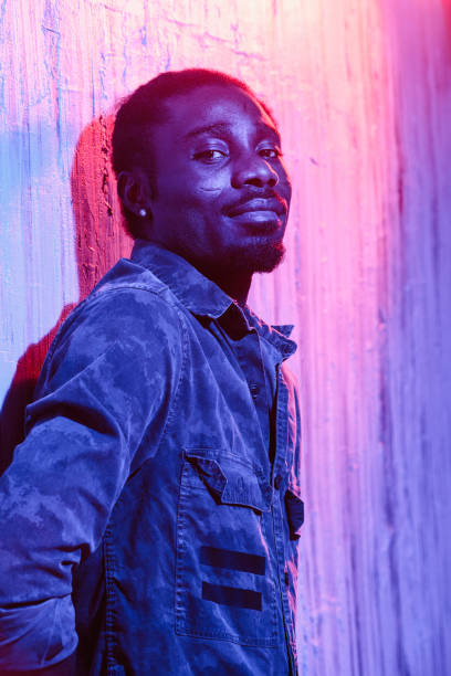 istock African-American male leaning on wall 1015314848