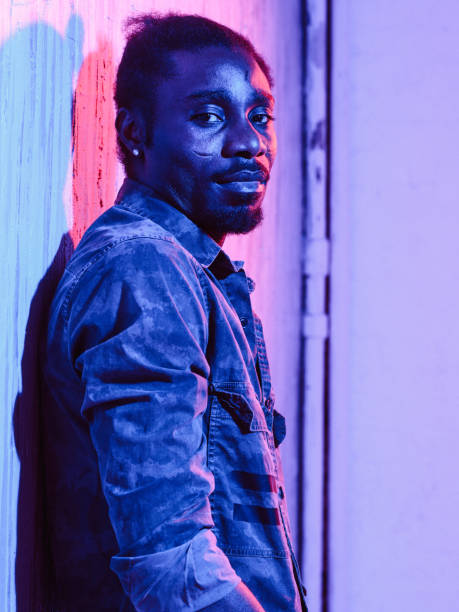 istock African-American male leaning on wall 1015315562