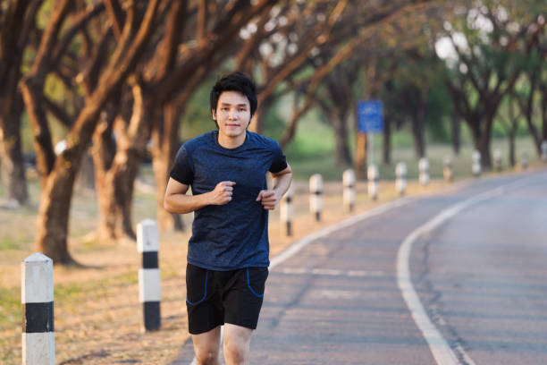 istock fitness man running in park 1015320546