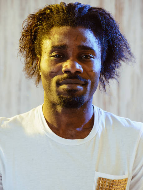 istock African-American?man with long hair looking at camera 1015320862