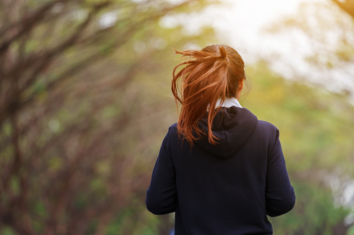 young fitness woman running in the park