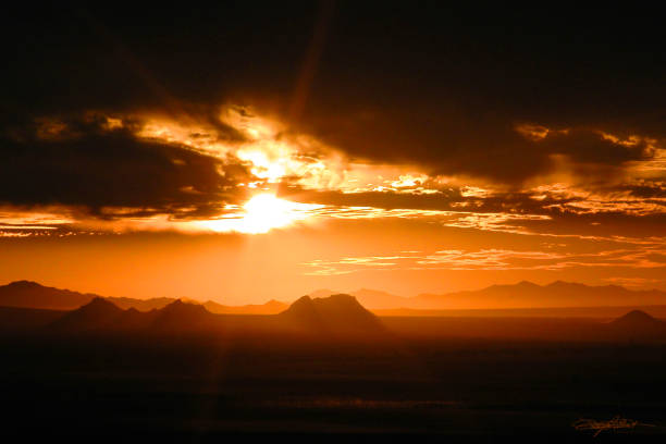 istock Fire Orange Sunset West of Picacho Peak in Arizona. 1015324350