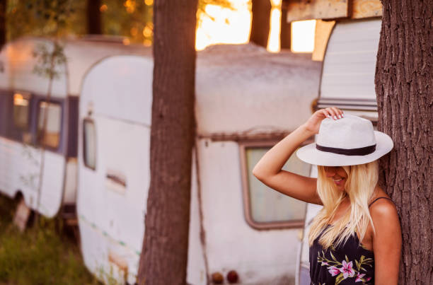 istock Woman With Travel Trailer Caravan 1015327108