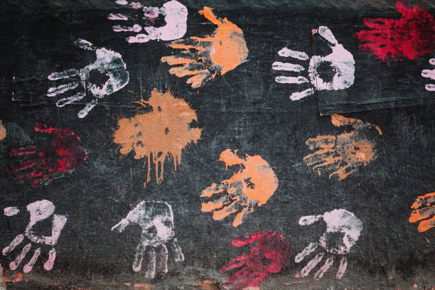 istock Colorful palm prints on black wall 1015327652