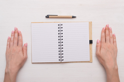 Lined blank page of notebook with metal rings