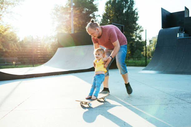 istock Dad teaching his son to skate 1015332264