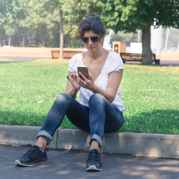 istock A brunette girl in the park 1015335504