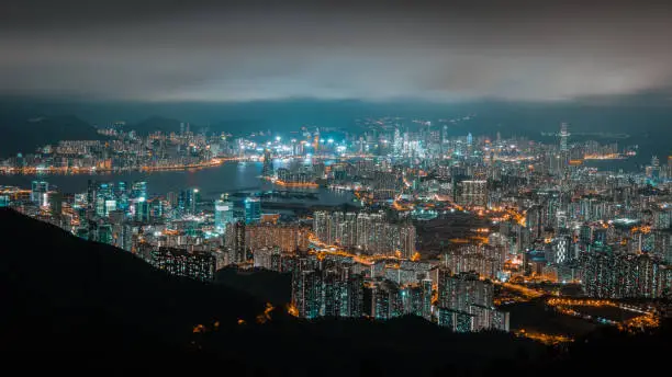 Famous Hong Kong night cityscape view from Kowloon, tuned in trend colours.