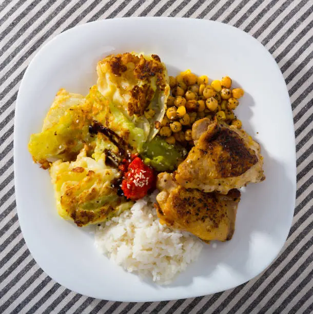 Photo of Fried chicken thighs with garnish