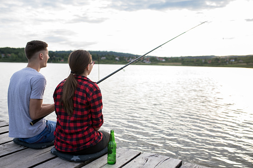 Man and woman fishing