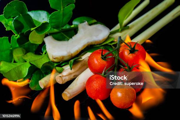 Burning Thai Tom Yam Herbs And Spices On Black Background Stock Photo - Download Image Now