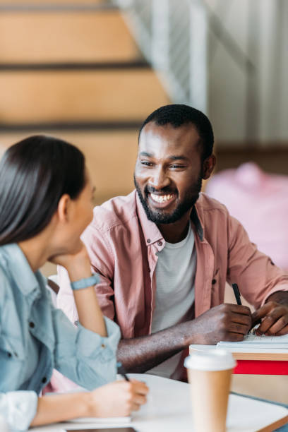 istock multiethnic young students chatting at classroom of college 1015350426