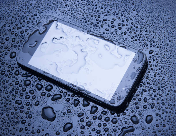 istock Wet smartphone, water drops on display. 1015351044