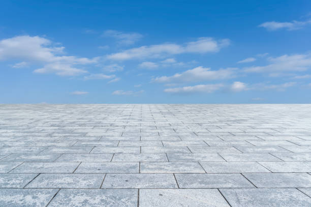 istock Empty,square,floor,tiles,and,beautiful,sky,landscape 1015351156