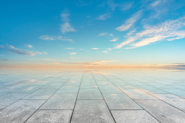 istock Empty,square,floor,tiles,and,beautiful,sky,landscape 1015351522
