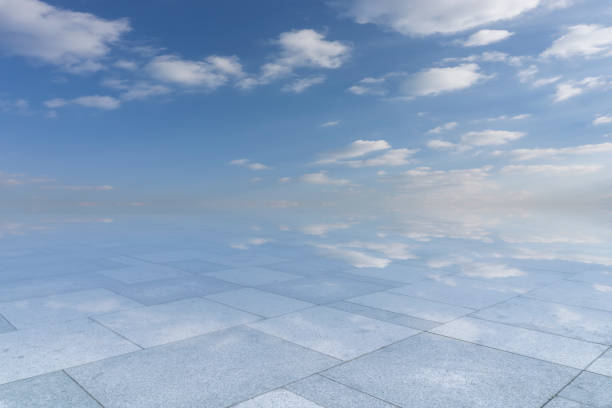 Image of a stone in the water and the reflection of the evening sky