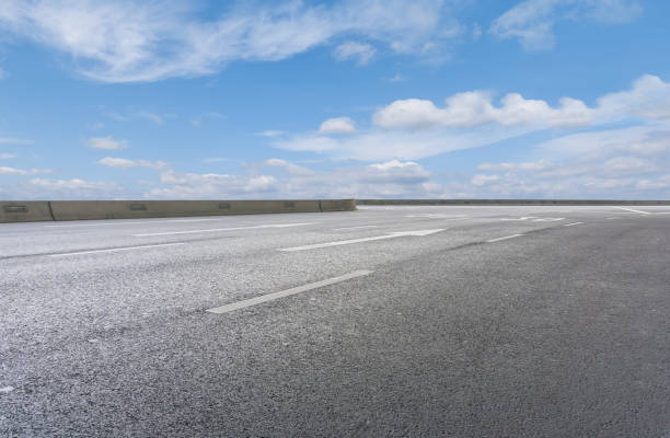 istock Empty,highway,asphalt,road,and,beautiful,sky,landscape 1015354804