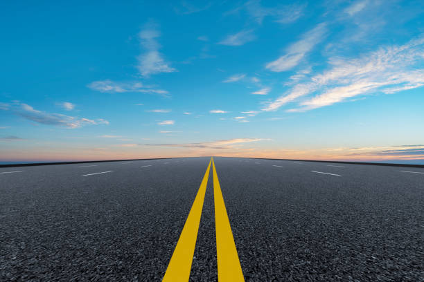 istock Empty,highway,asphalt,road,and,beautiful,sky,landscape 1015357536