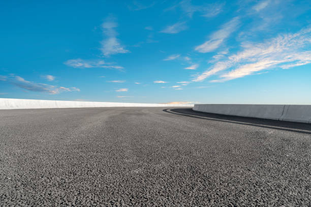 istock Empty,highway,asphalt,road,and,beautiful,sky,landscape 1015357560