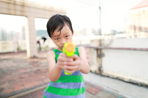 Children playing with squirt gun
