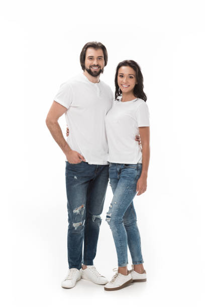 istock smiling couple hugging and looking at camera isolated on white 1015362500