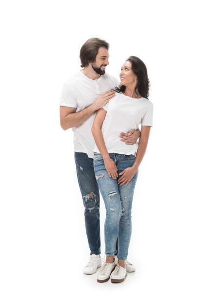 istock smiling couple looking at each other isolated on white 1015362528