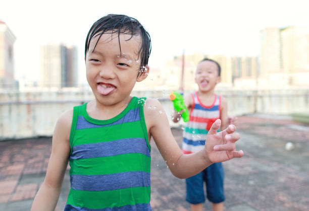 Children playing with squirt gun