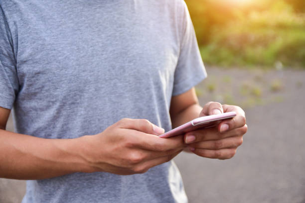 istock Man holding smartphone and using smart phone social network by internet online 1015369162