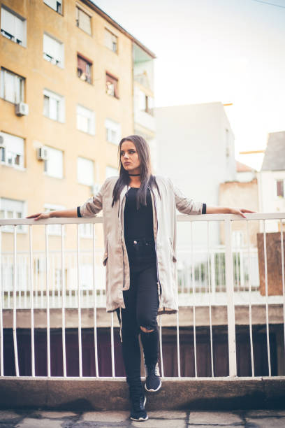istock Young girl leaning on a fence 1015373970