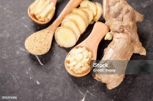 Ginger Root Ginger Slice And Ginger Powder On Stone Background Table Space For Text Stock Photo - Download Image Now